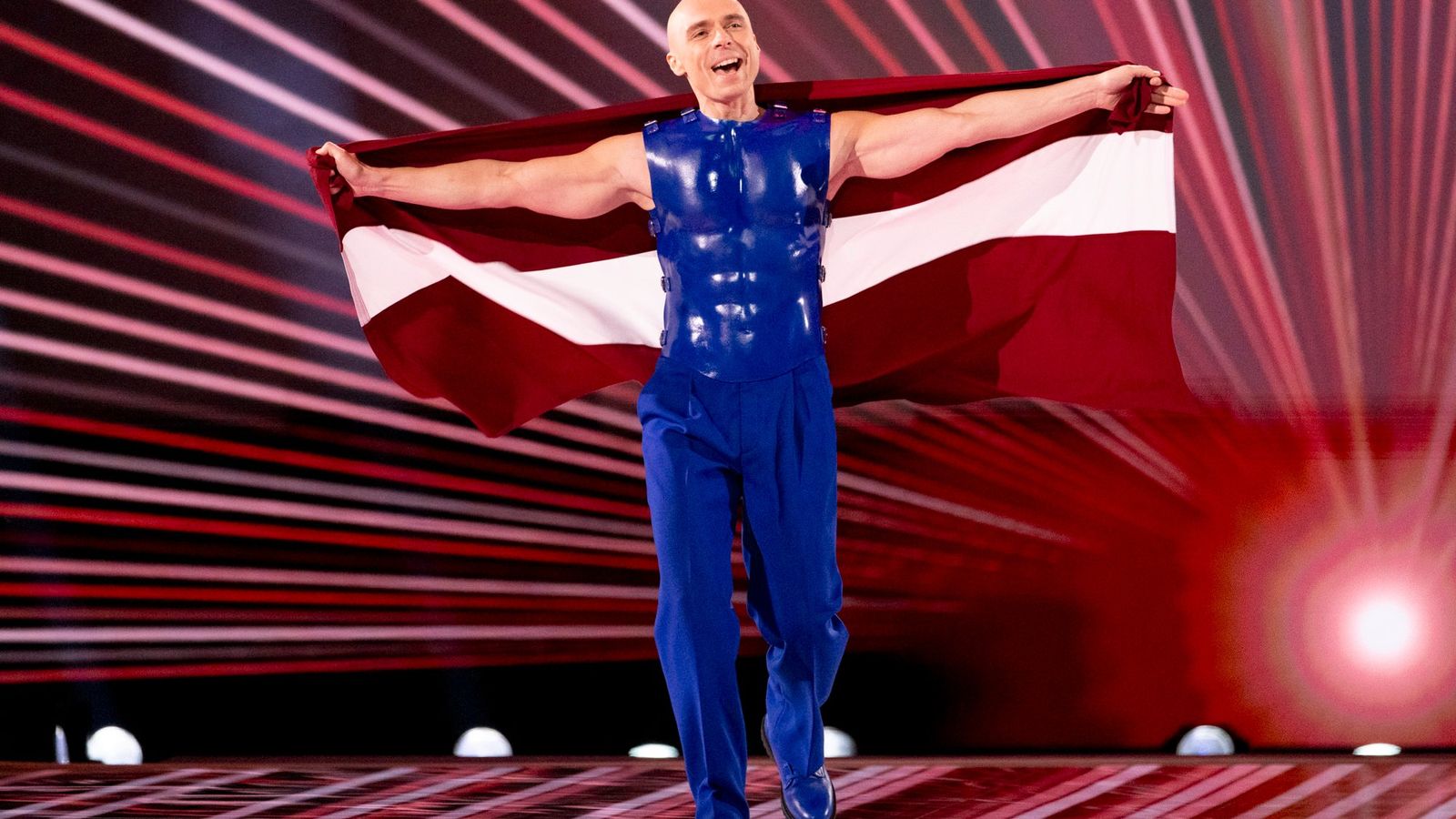 Dons representing Latvia, walking the Flag Parade at the Grand Final in Malmö Arena