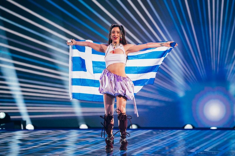 Marina Satti walks the Flag Parade for Greece at the Grand Final in Malmö Arena