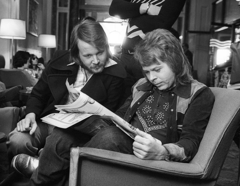 Benny & Björn reading what the papers had to say about them in Brighton, 1974