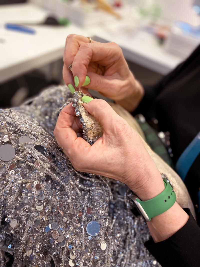 Karolina Nilsson sewing a costume in her workroom in Malmö arena