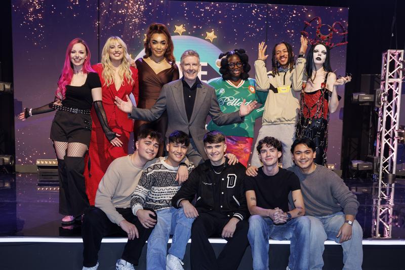 Host Patrick Kielty poses with the 6 acts competing in 'Eurosong 2024' in Ireland