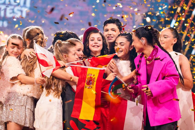 Lou Deleuze celebrating with the Junior Eurovision singers, after winning for France in Tbilisi, Georgia