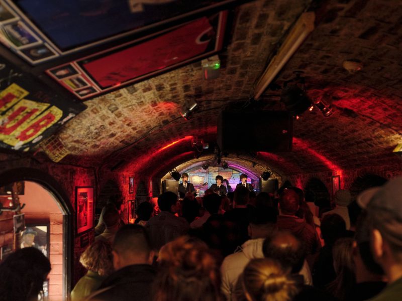 Stop by Liverpool's Cavern Club, where the Beatles were originally discovered, to catch a cover band playing some classic tunes. Image provided by Booking.com.