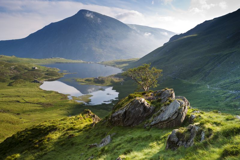 The mountains and glacial features of the vast Snowdonia National Park in northwest Wales will take your breath away.