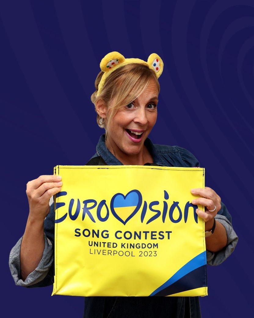 Mel Giedroyc showing off a one-of-a-kind Liverpool 2023 bag